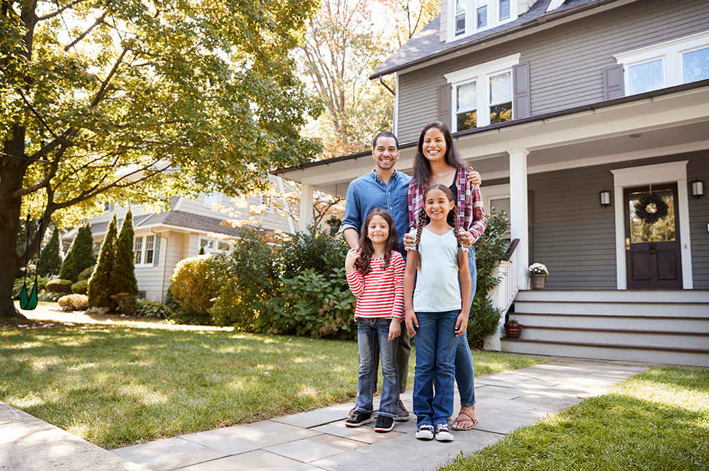 A veteran family outside of their home after looking over military retirement final pay