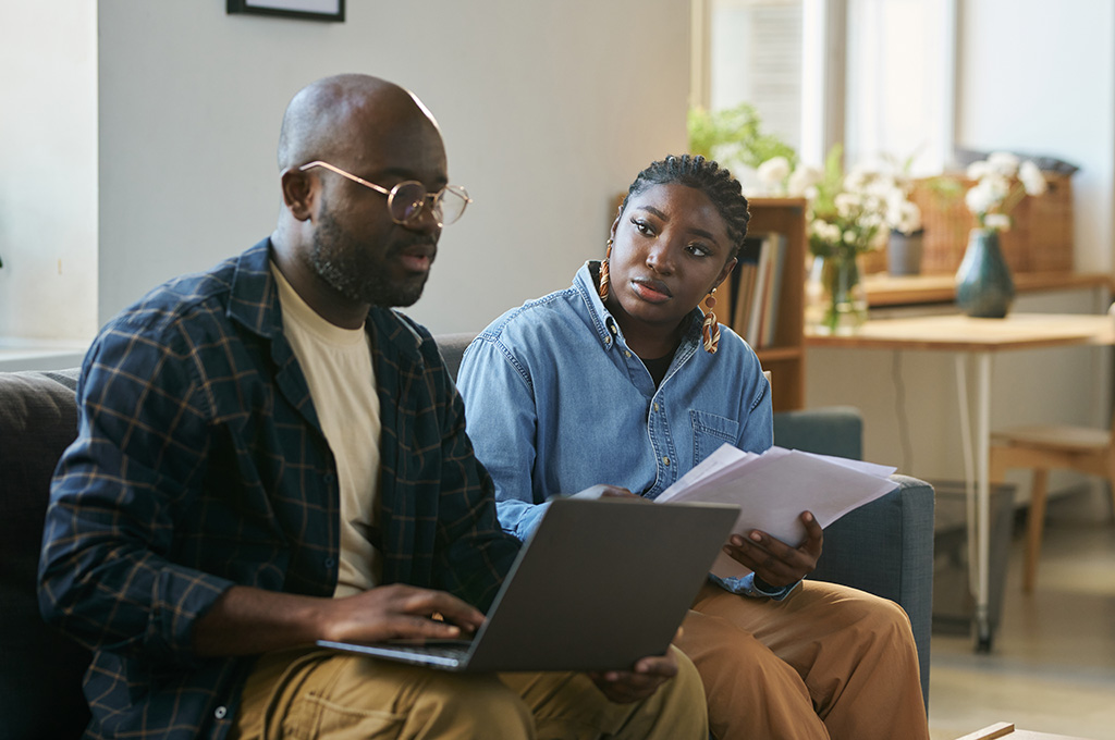 A veteran couple at home doing their taxes