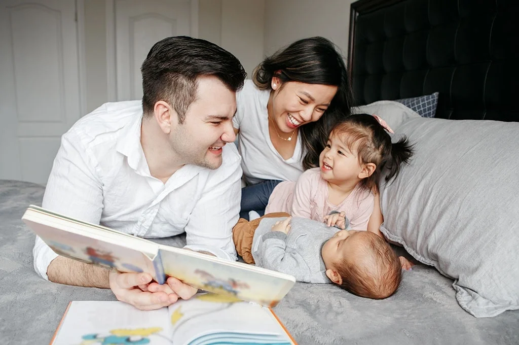 Veteran parents reading books to their children