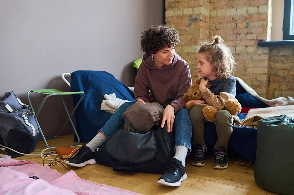 A veteran spends time with her son in his room