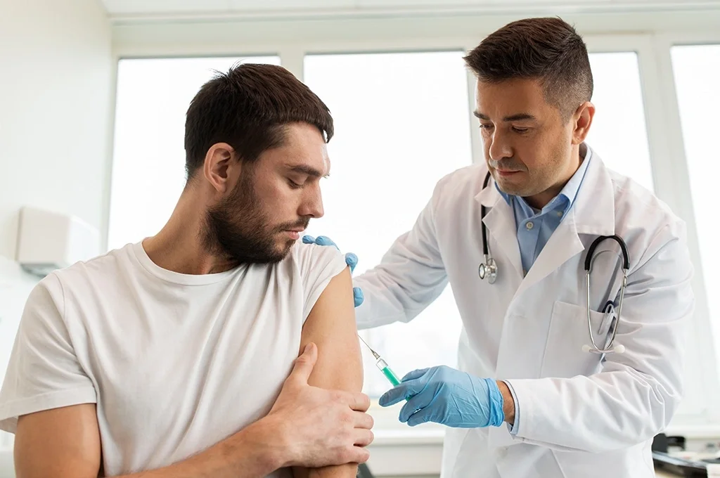 Man getting a shot at the hospital