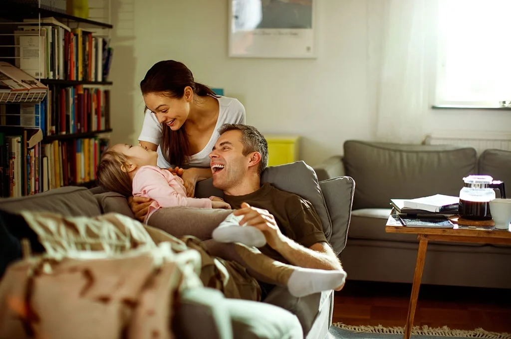 A veteran shares a moment with his family at home
