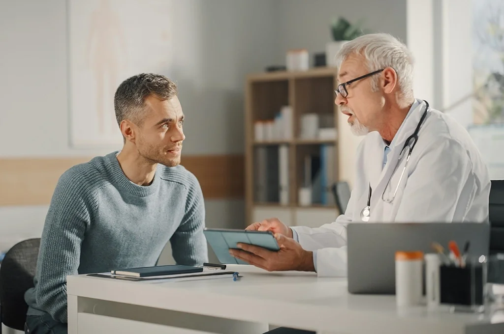 A veteran talking with his doctor after exploring his va disability benefits eligibility